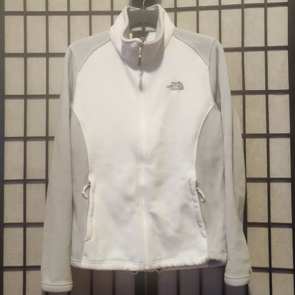 White & gray zip up north face jacket